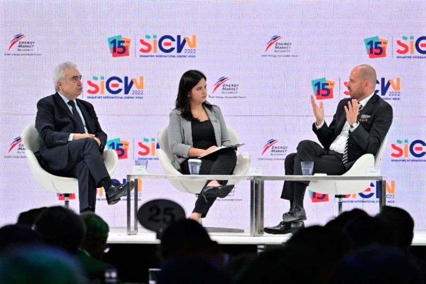 A group of people sitting on a stage Description automatically generated with low confidence